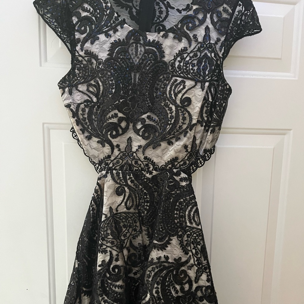 Sequin dress is from Camille lavie (group USA). Back cutout , tulle